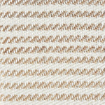 Detail of a textural rug in natural fiber and white yarn.