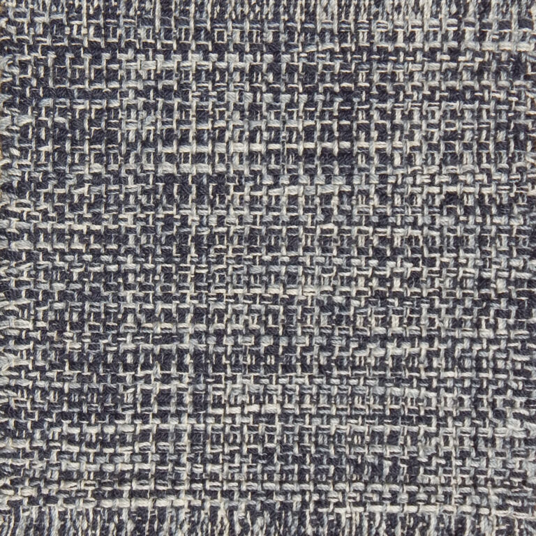 Detail of a flatweave with a strié effect in shades of grey