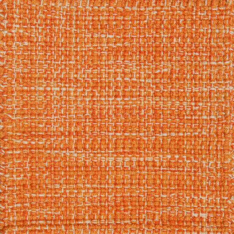 Detail of a flatweave with a strié effect in shades of bright orange