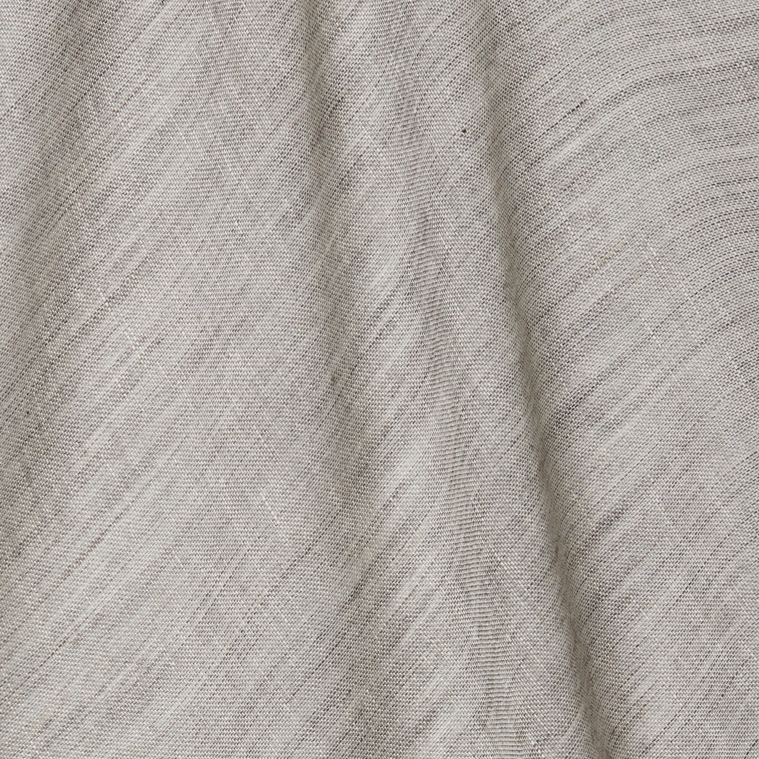A draped swatch of open-weave sheer interior fabric in a mottled light gray color.
