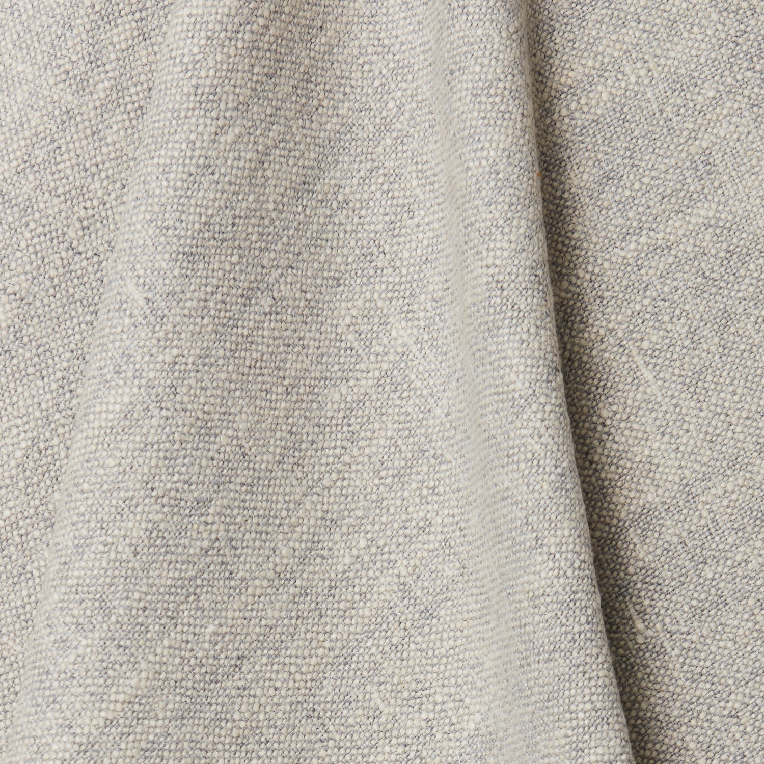 A rumpled swatch of blended linen fabric in a mottled light gray color.
