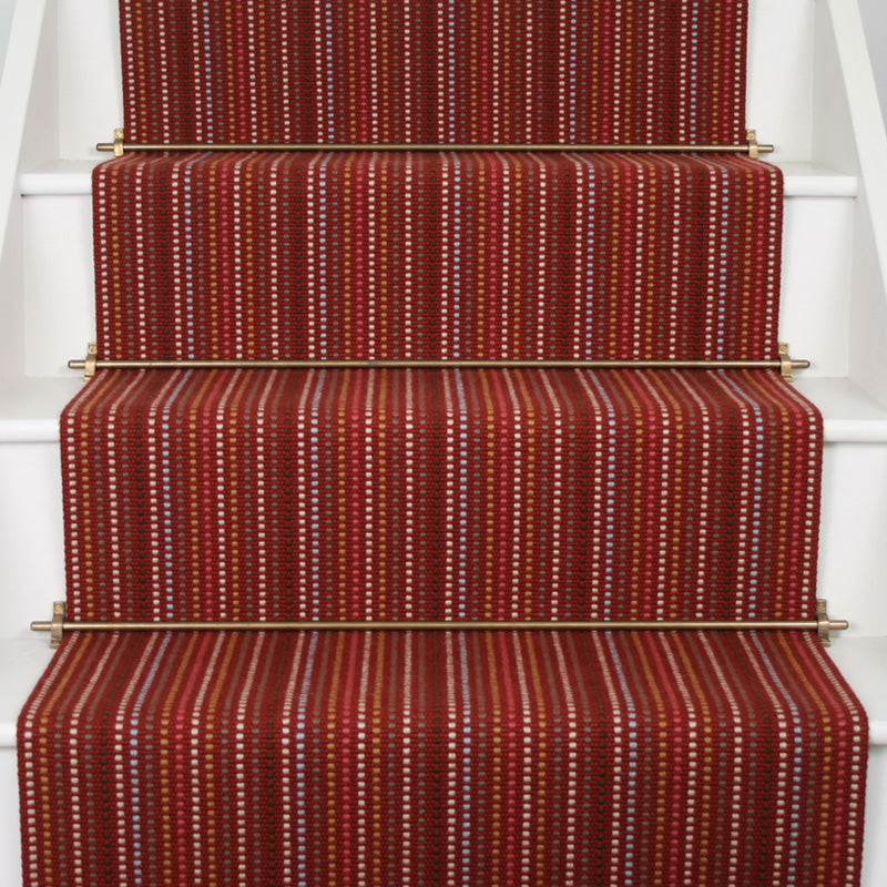 Striped flatweave runner in red on white staircase
