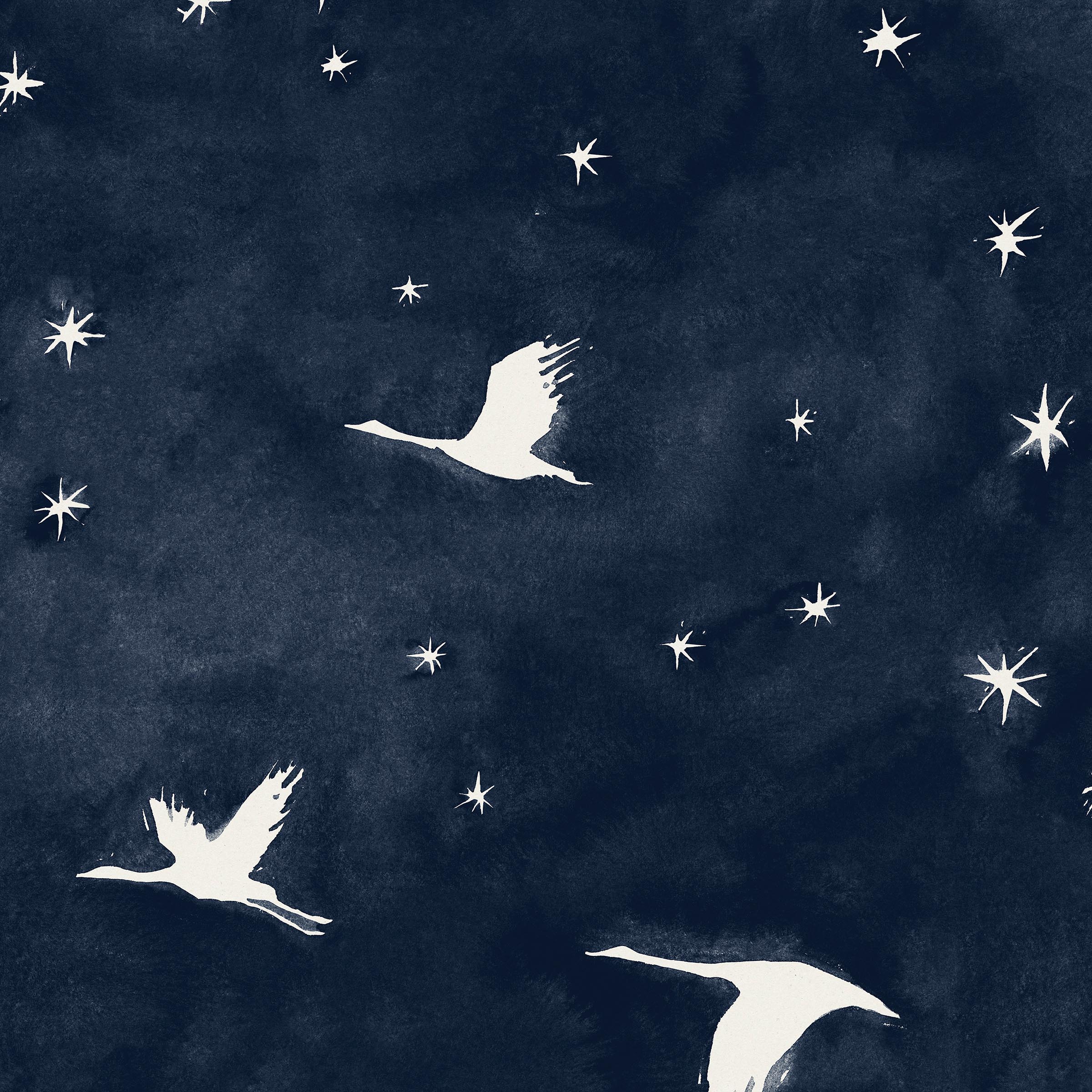 Detail of wallpaper in a repeating print of birds and stars in white on a navy watercolor field.
