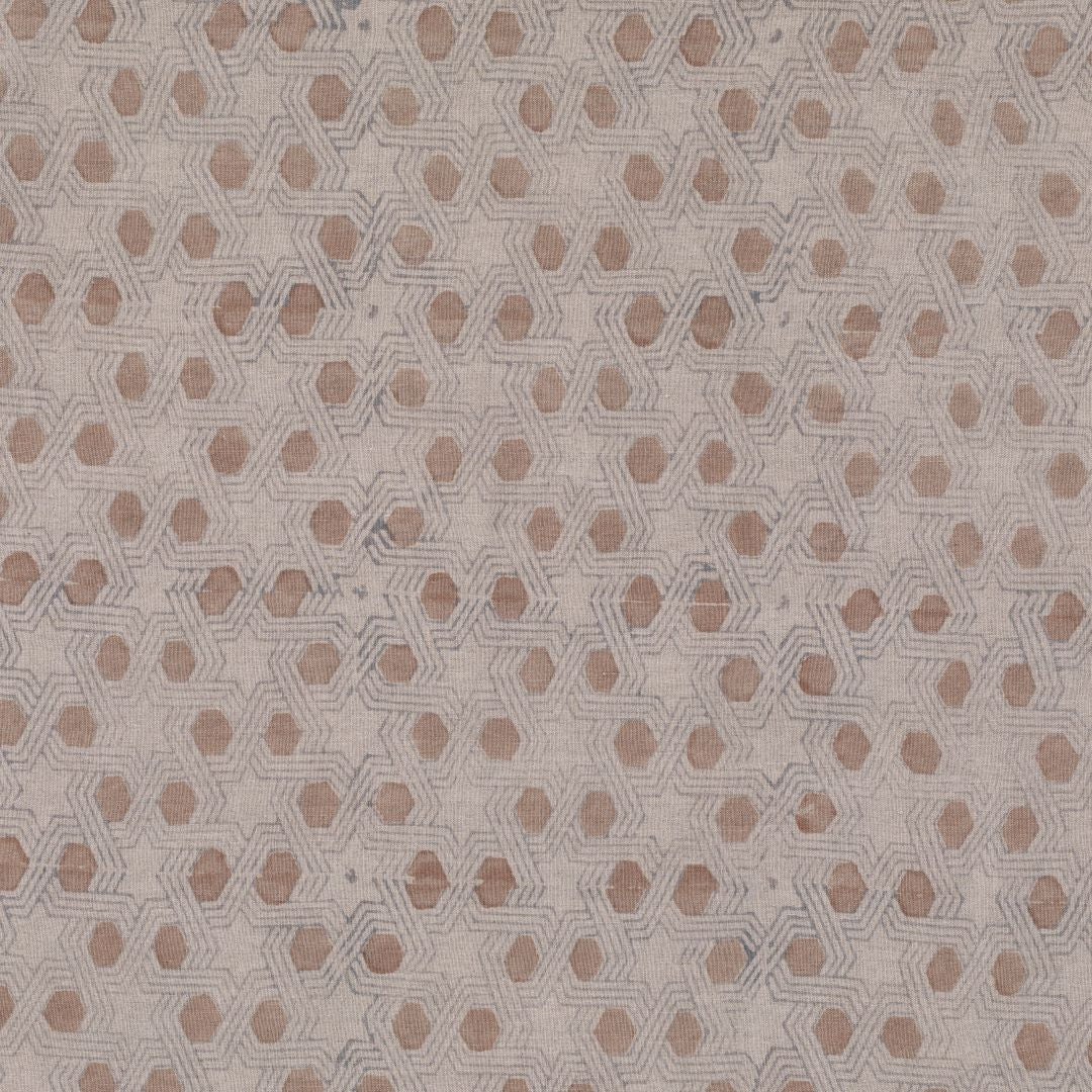 Detail of fabric in a star-shaped lattice print in tan and gray on a cream field.