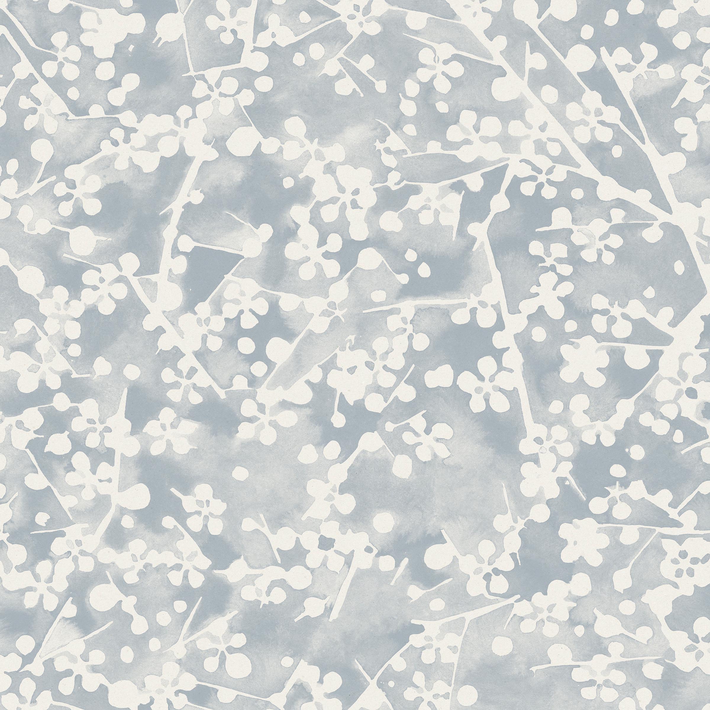 Detail of wallpaper in a painterly branch print in white on a blue-gray watercolor field.
