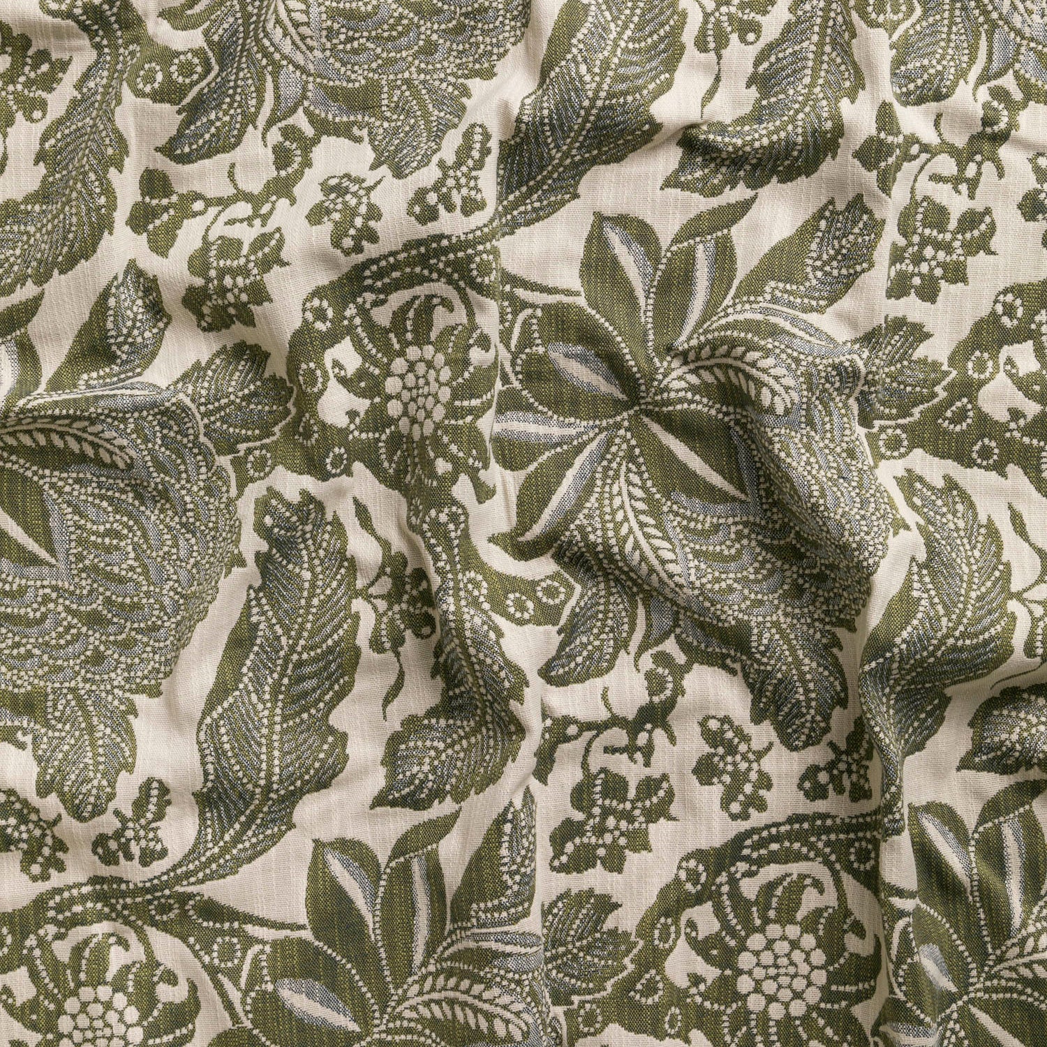 Detail of wallpaper in a repeating botanical print in sage and gray on a cream field.