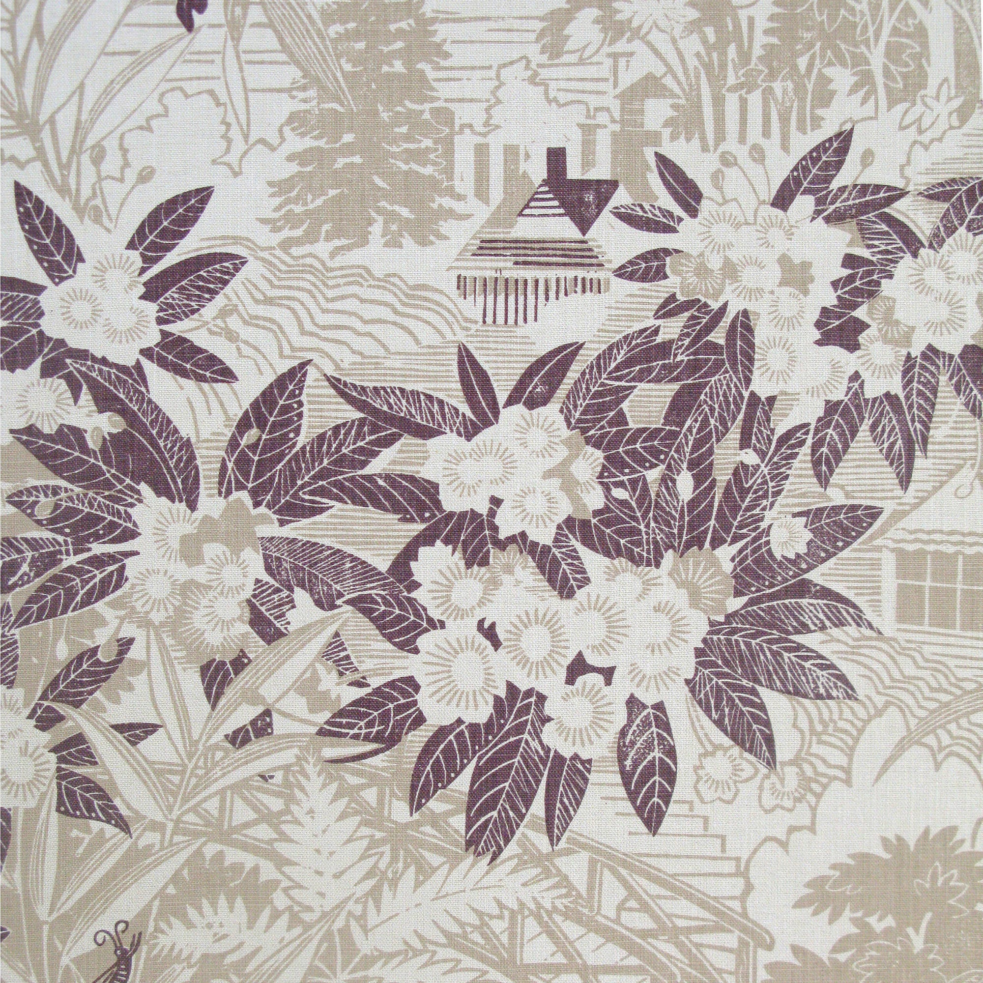 Detail of fabric in an intricate botanical, bridge and house print in tan and maroon on a cream field.