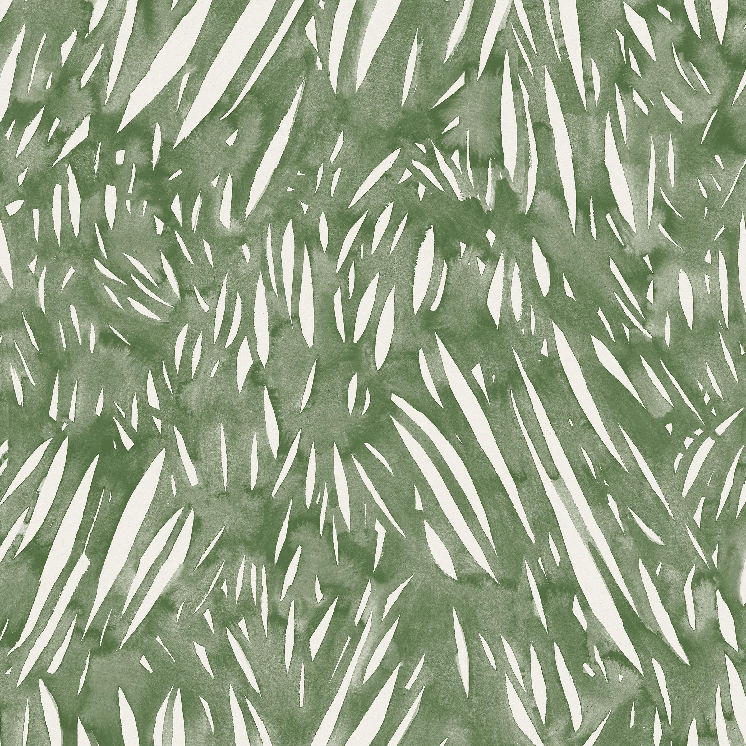 Detail of fabric in an abstract leaf pattern in white on a green watercolor field.