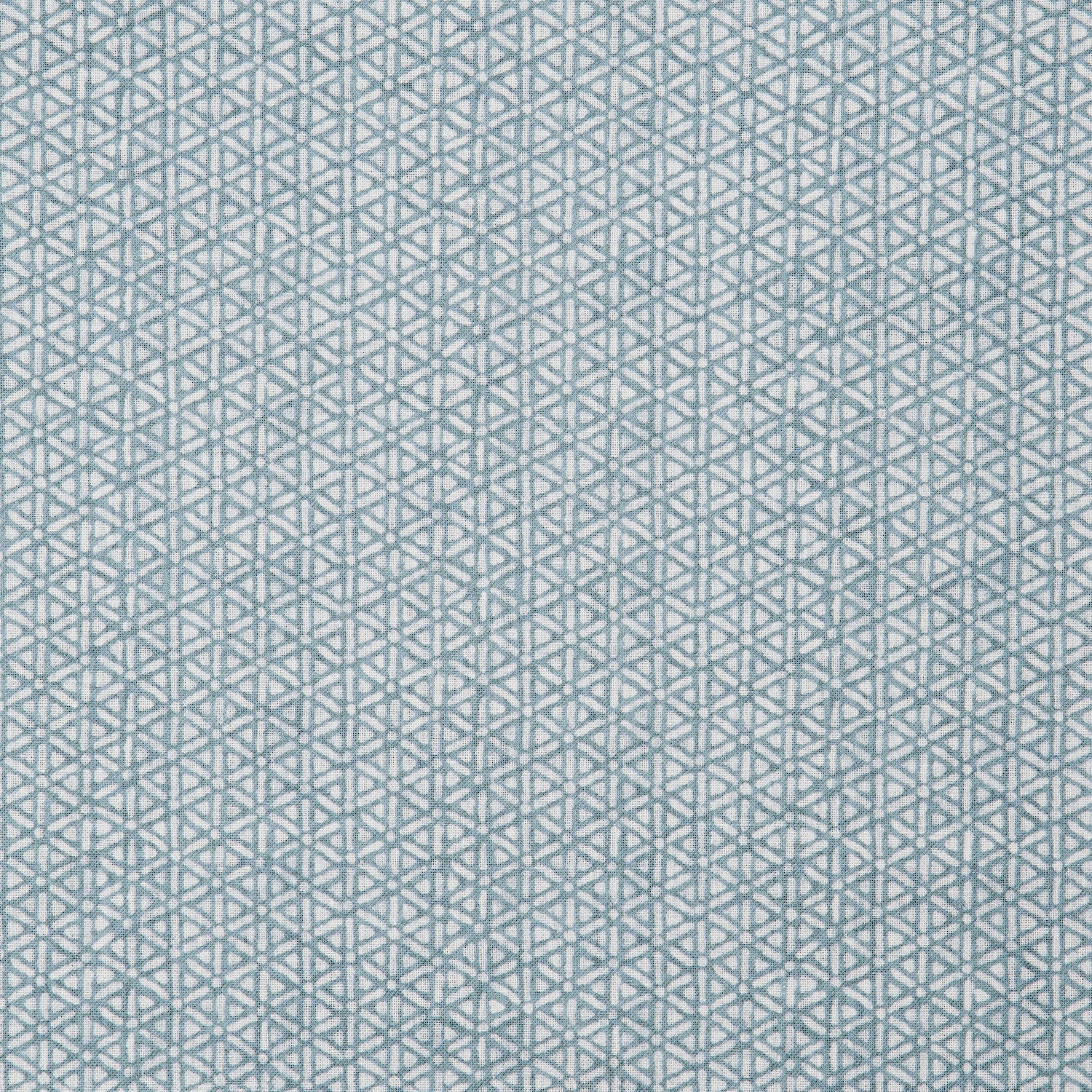 Detail of a linen fabric in a detailed geometric pattern in white on a light blue field.