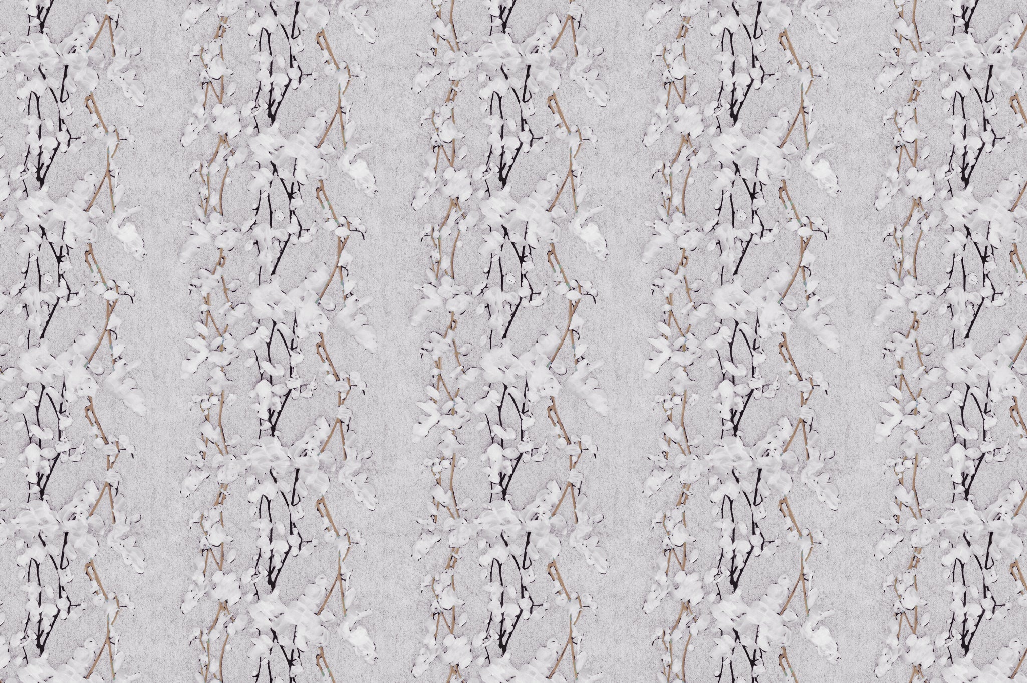 Detail of fabric in a striped wisteria print in shades of white and brown on a light gray field.