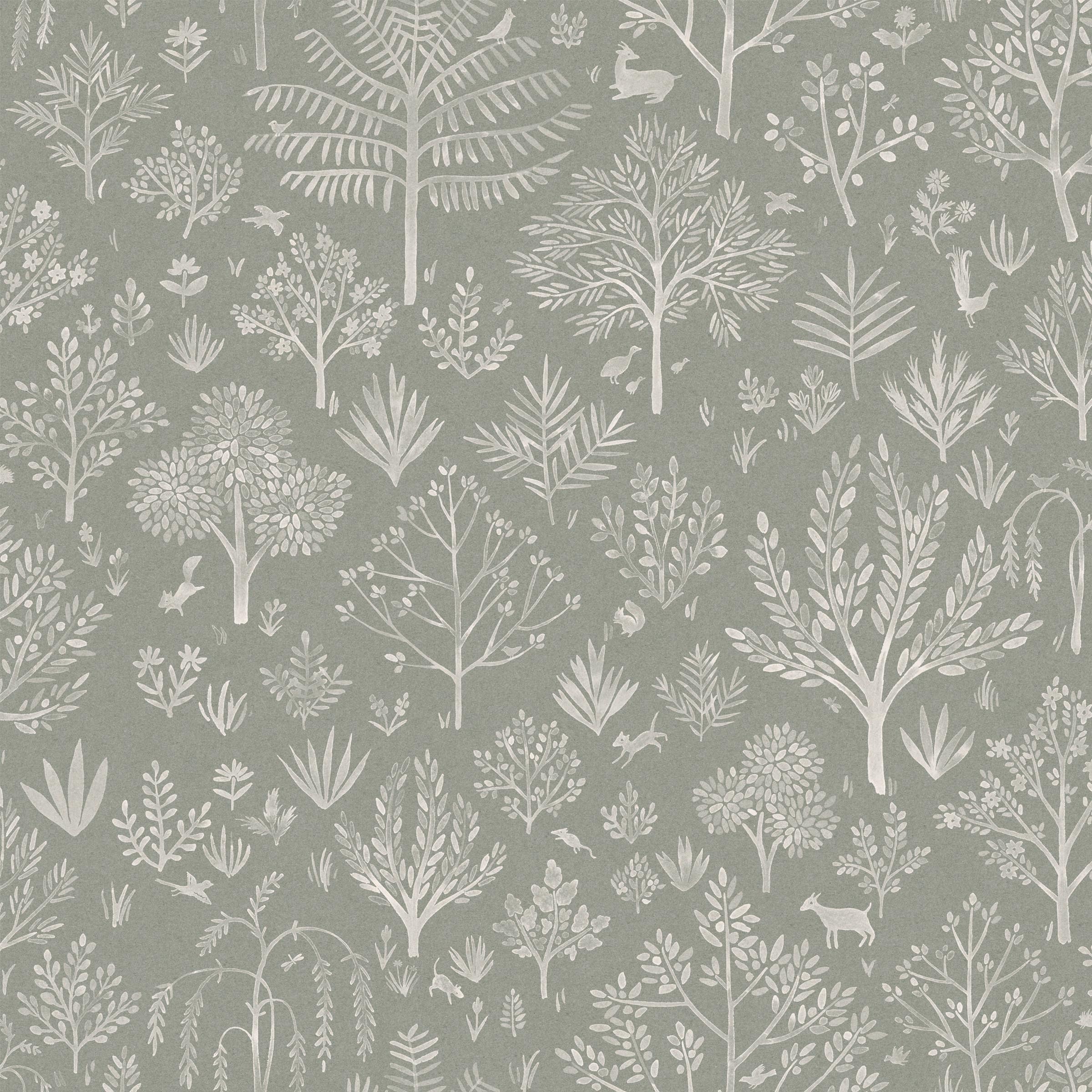 Detail of fabric in a playful animal and tree print in white on a sage field.