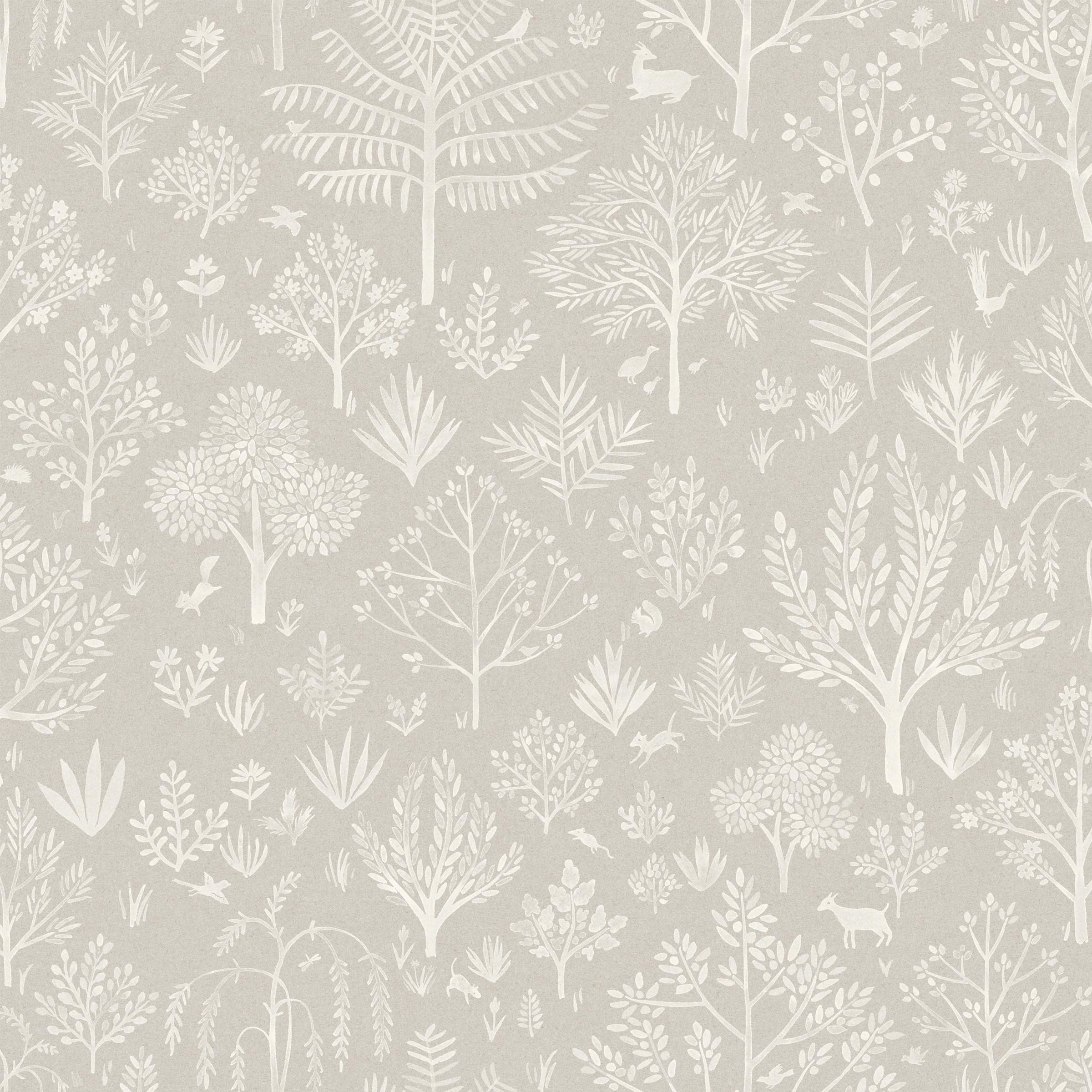 Detail of fabric in a playful animal and tree print in white on a greige field.