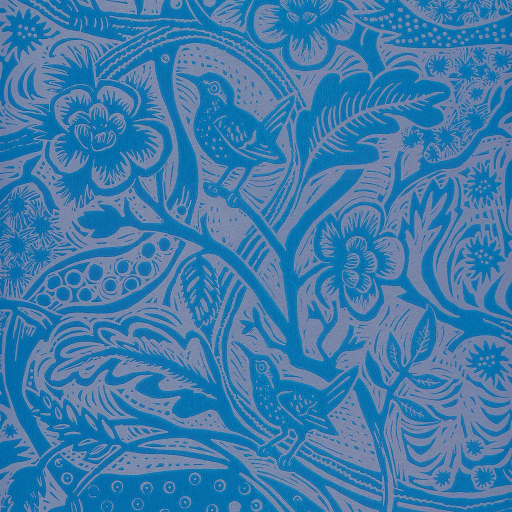 Detail of wallpaper in a playful wren and flower print in blue and mauve.