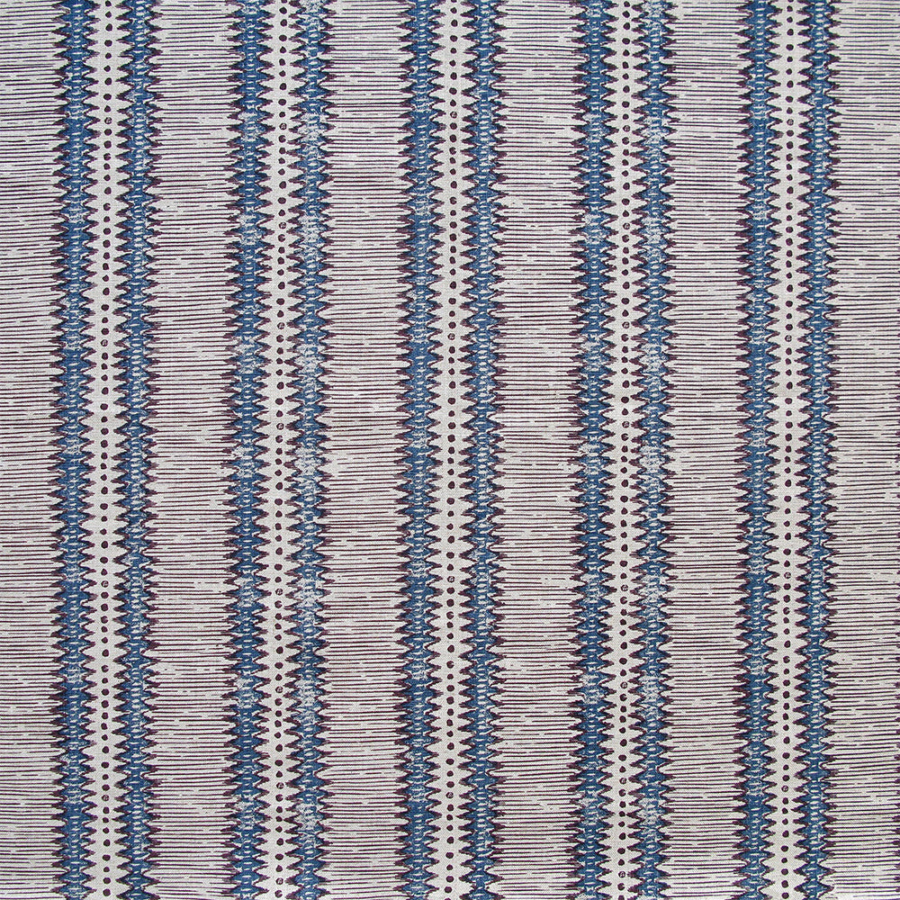 Detail of fabric in a dense tribal stripe pattern in shades of greige, brown and navy.