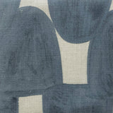 Close-up of fabric in an abstract scalloped print in navy on a tan field.