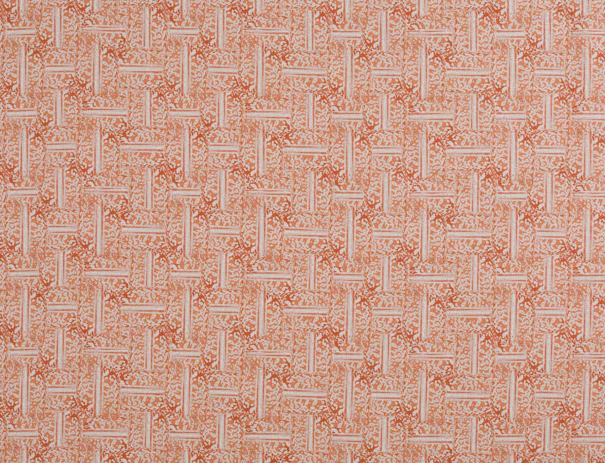 Detail of fabric in a geometric grid pattern in coral on a cream field.