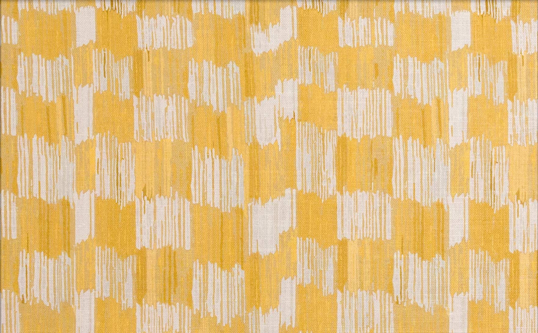 Detail of fabric in an abstract check print in shades of yellow and white.