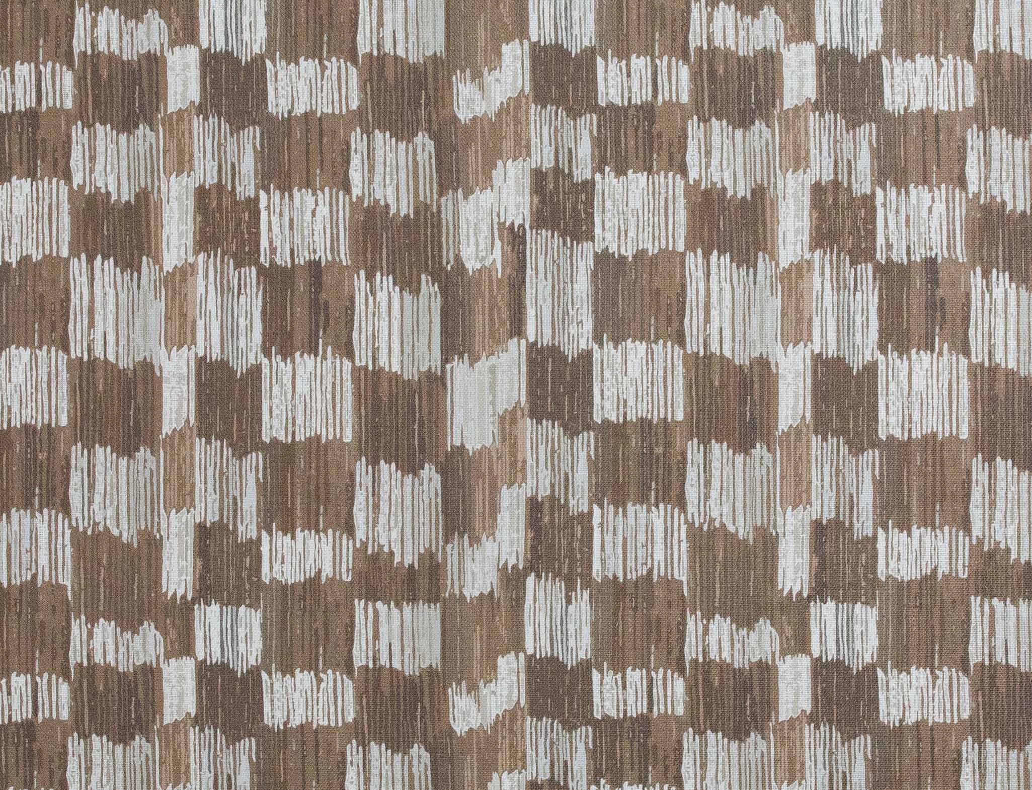 Detail of fabric in an abstract check print in shades of brown and gray.