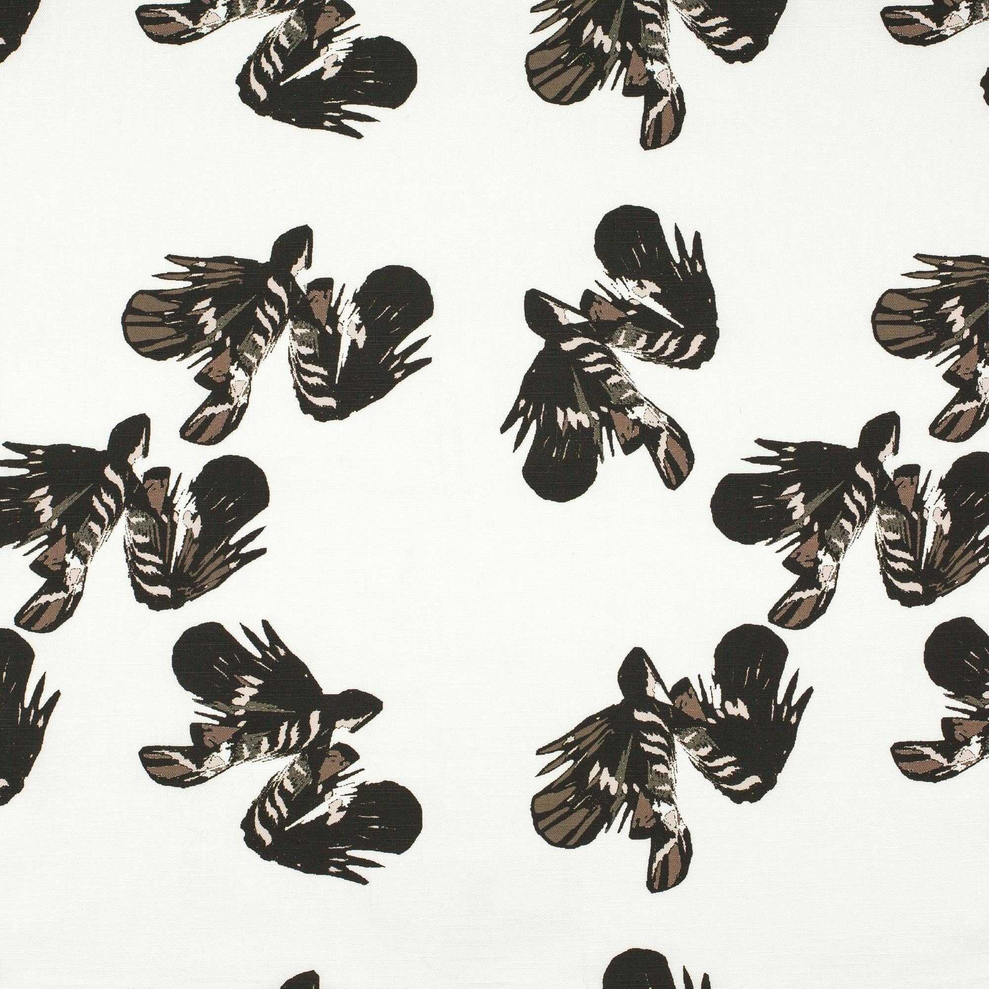 Detail of fabric in a playful feather print in dark brown and tan on a cream field.