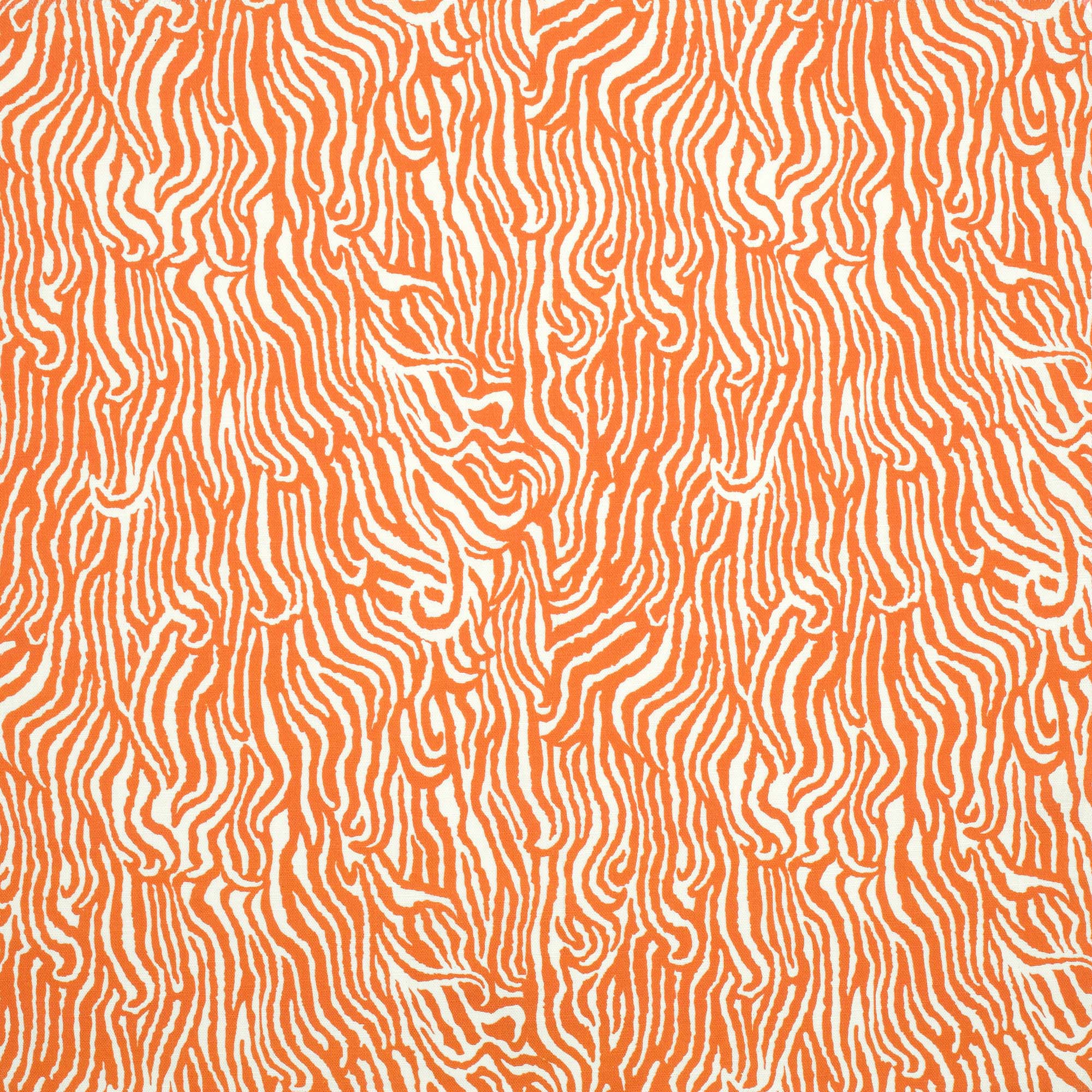 Detail of fabric in a playful animal print in orange on a white field.