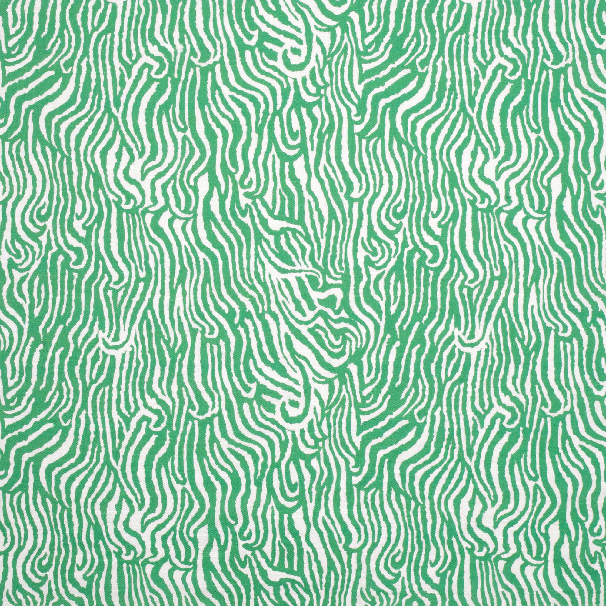 Detail of fabric in a playful animal print in light green on a white field.