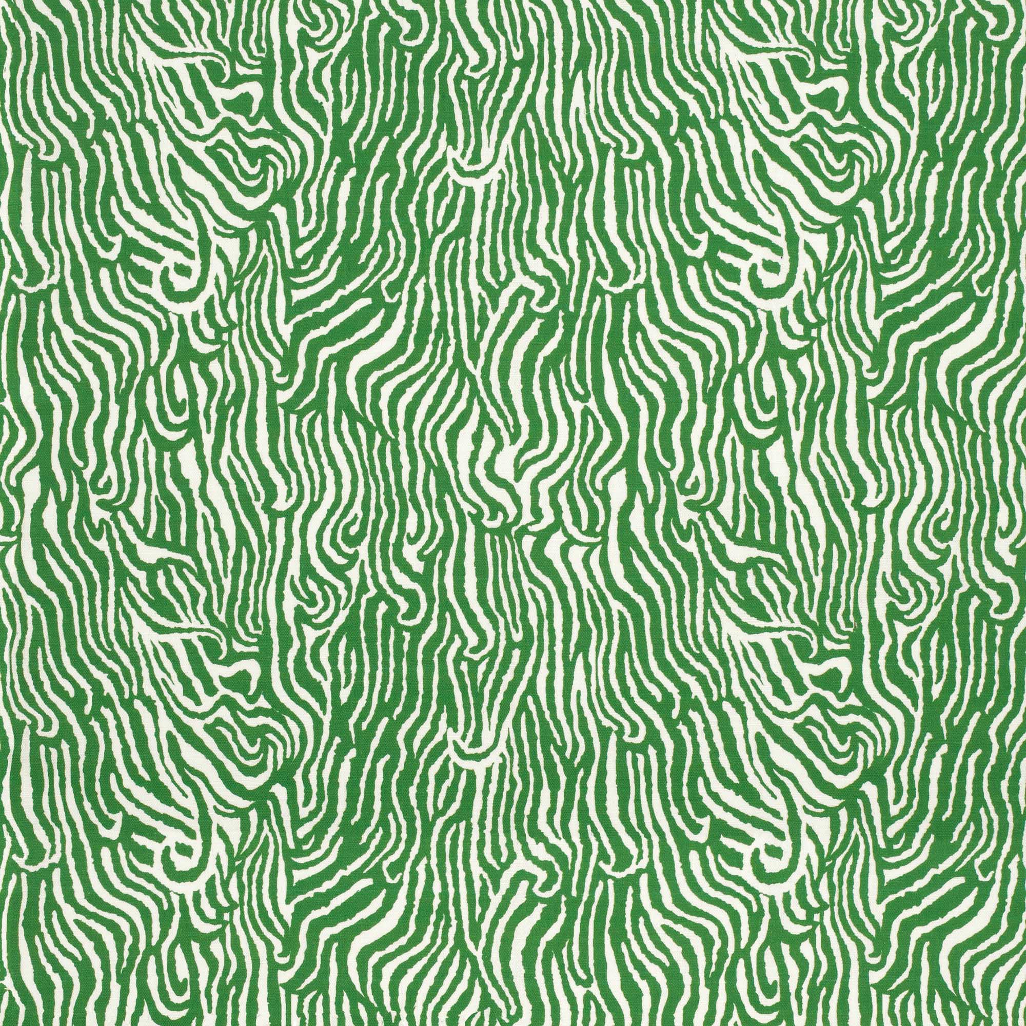Detail of fabric in a playful animal print in green on a white field.