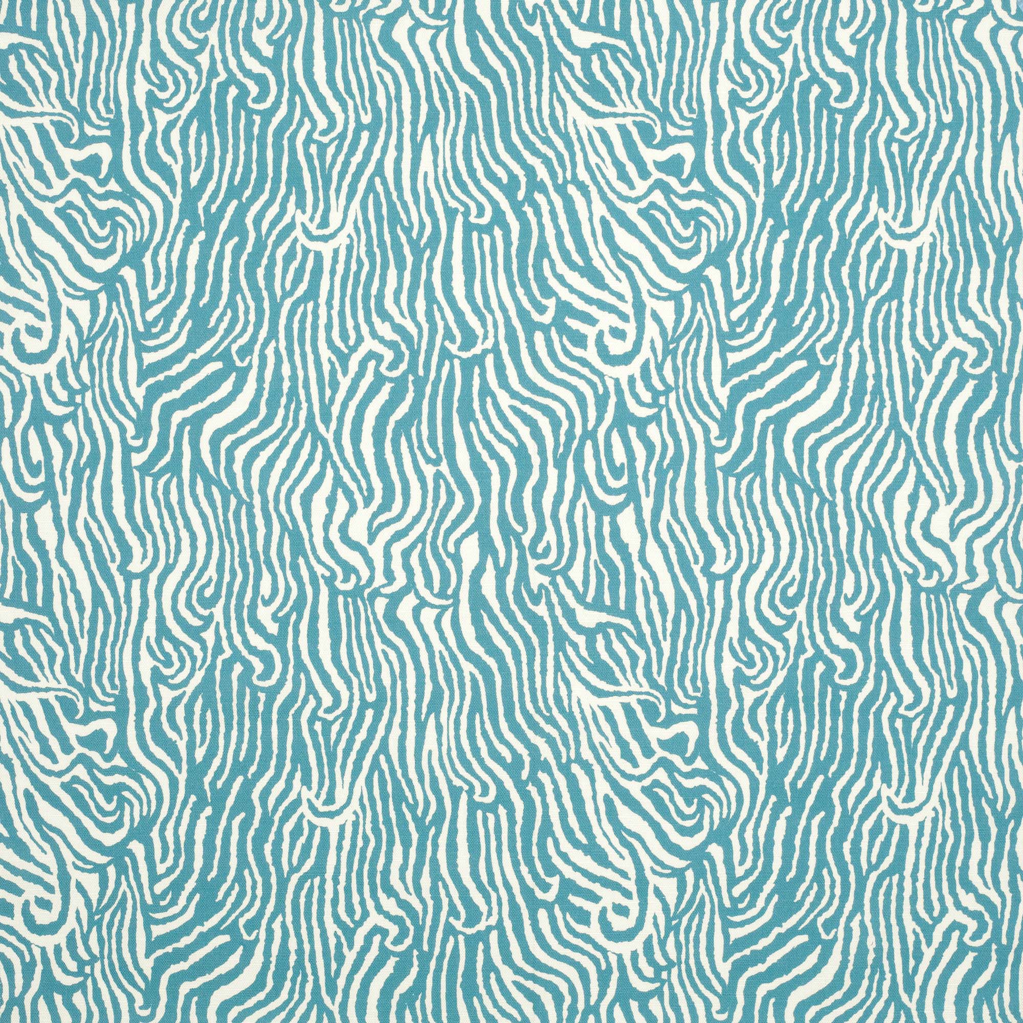 Detail of fabric in a playful animal print in blue on a white field.