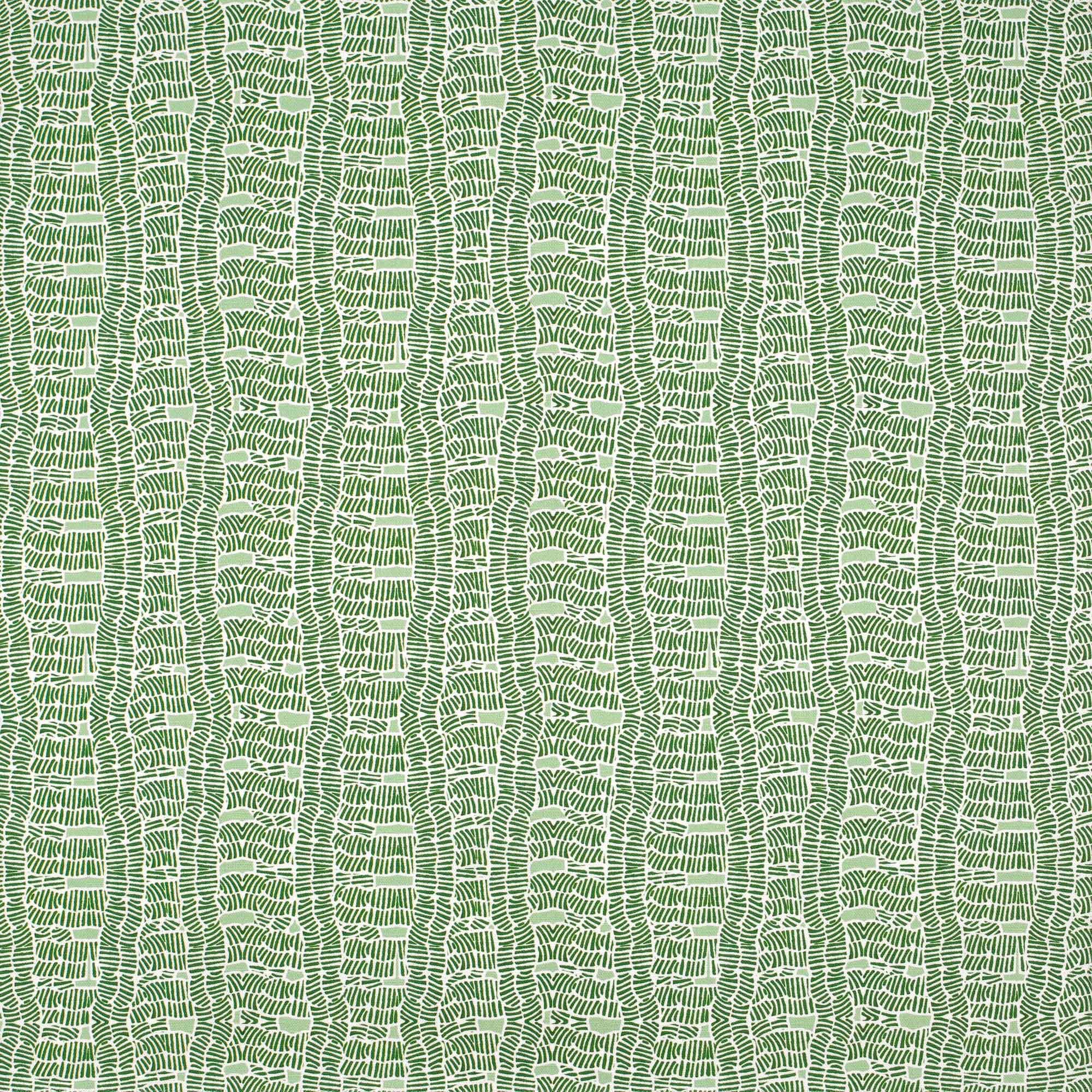 Detail of fabric in a playful curvy grid print in green on a white field.
