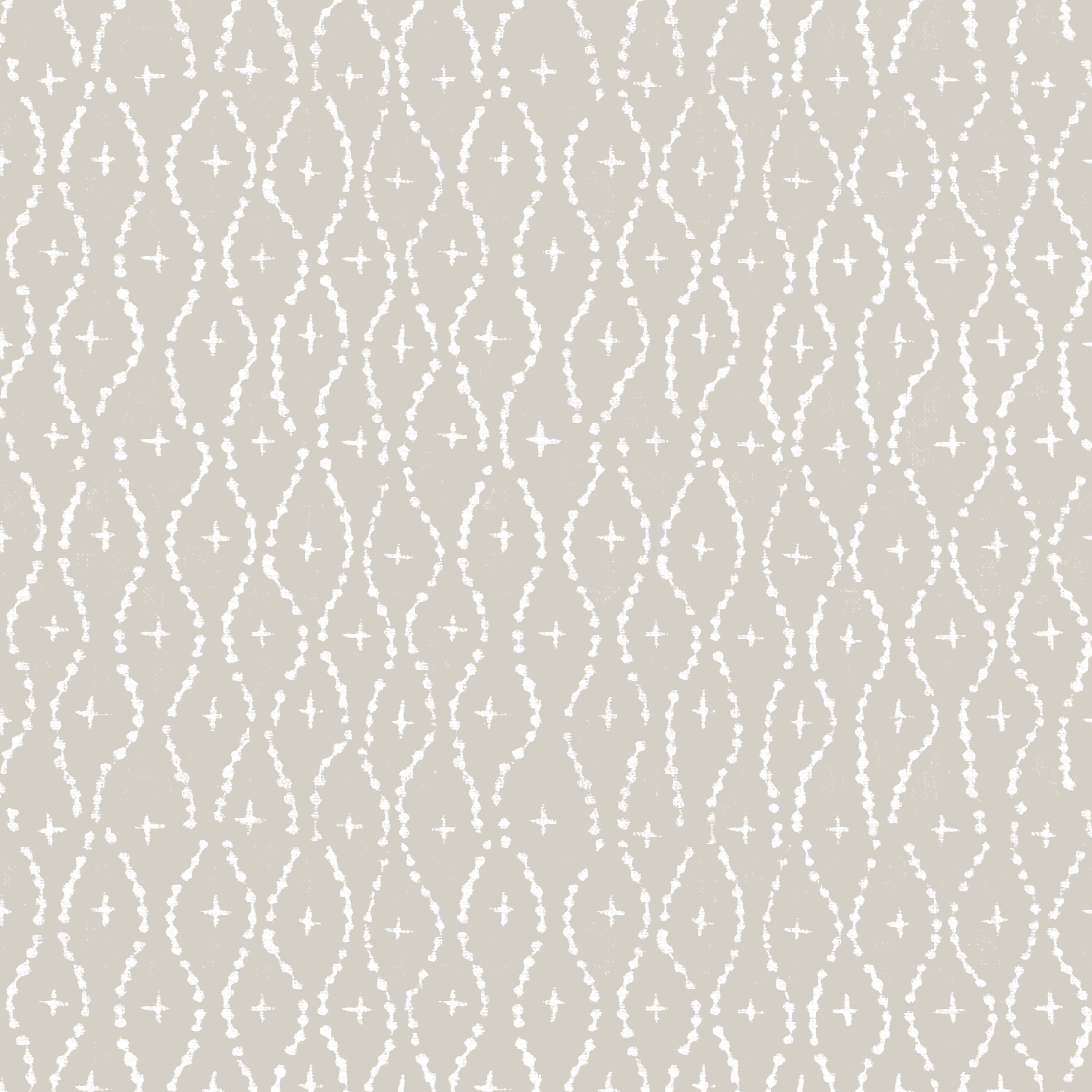 Detail of wallpaper in a painterly lattice print in white on a tan field.