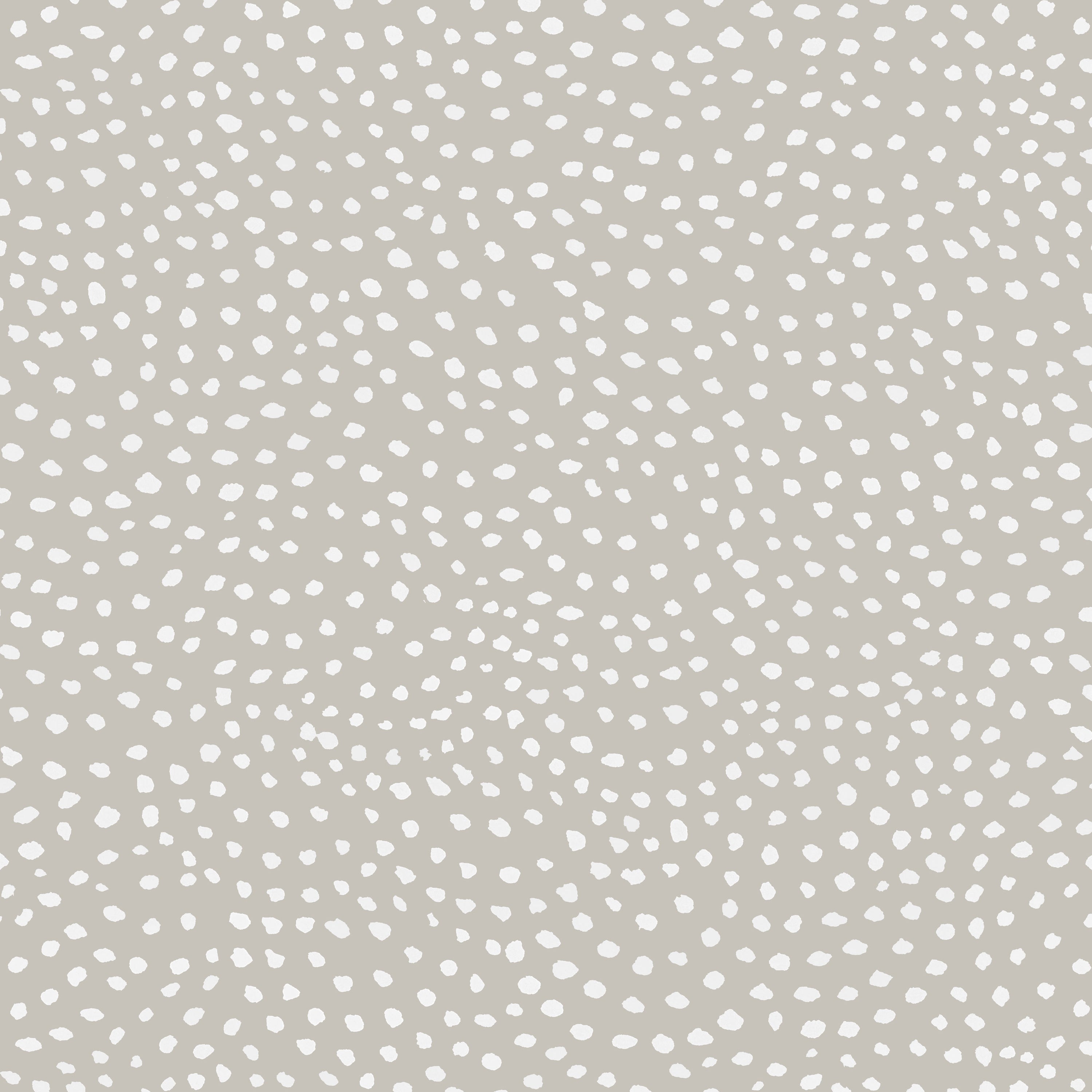 Detail of wallpaper in a scalloped dot print in white on a tan field.