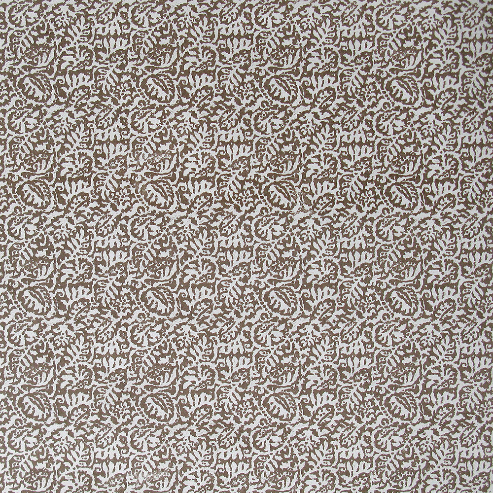 Detail of wallpaper in a dense paisley print in white on a brown field.