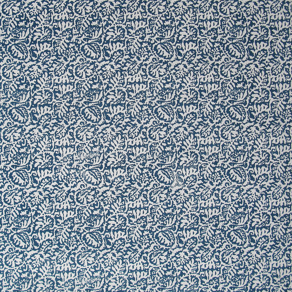Detail of wallpaper in a dense paisley print in white on a navy field.