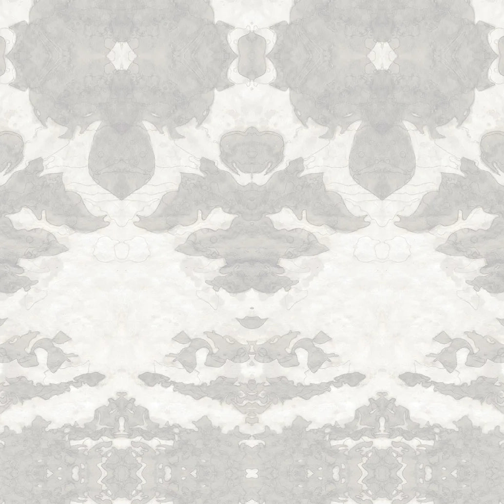 Detail of wallpaper in a painterly ikat print in shades of gray and cream.