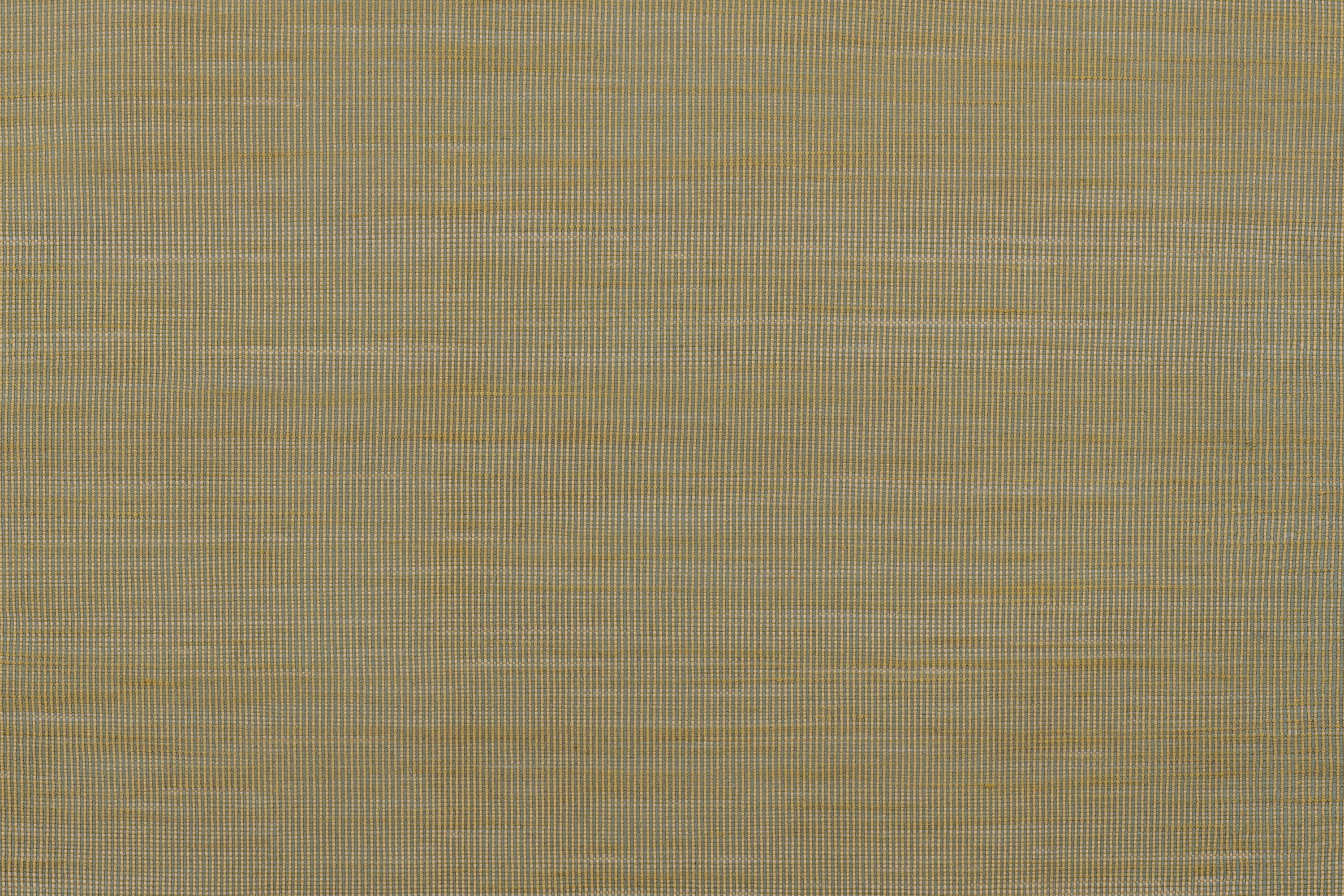 Detail of of the Moire Rug in Artemesia, a subtle striated pattern in lime green. 