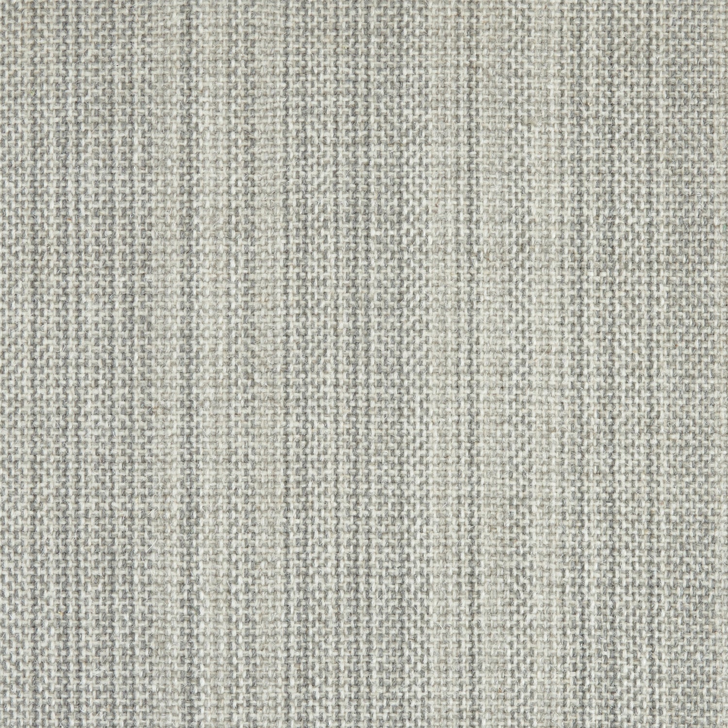 Wool broadloom carpet swatch in a light gray colorway mottled with white and gray fibers.