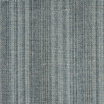Wool broadloom carpet swatch in a blue-gray colorway mottled with light gray fibers.
