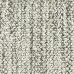 Wool broadloom carpet swatch in a chunky fiber weave mottled black and cream.
