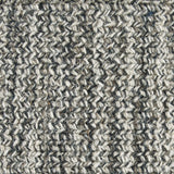 Wool broadloom carpet swatch in a chunky fiber weave mottled black, brown and cream.
