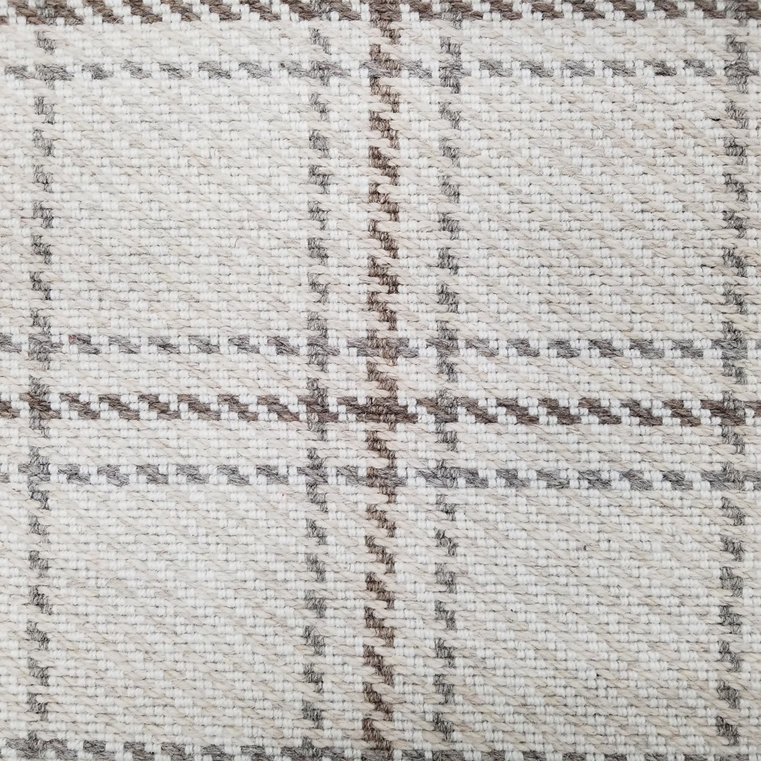 Wool broadloom carpet swatch in houndstooth plaid in shades of cream, gray and brown.