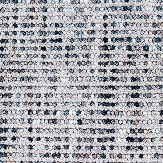 Wool broadloom carpet swatch in a looped stripe weave in gray, blue and navy.