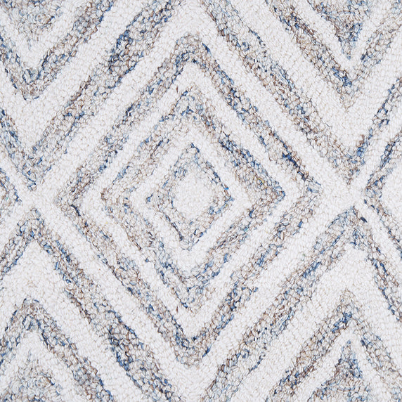 Wool broadloom carpet swatch in a painterly diamond pattern in white and gray speckled with blue.