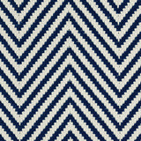 Outdoor broadloom carpet swatch in a herringbone weave in navy and cream.