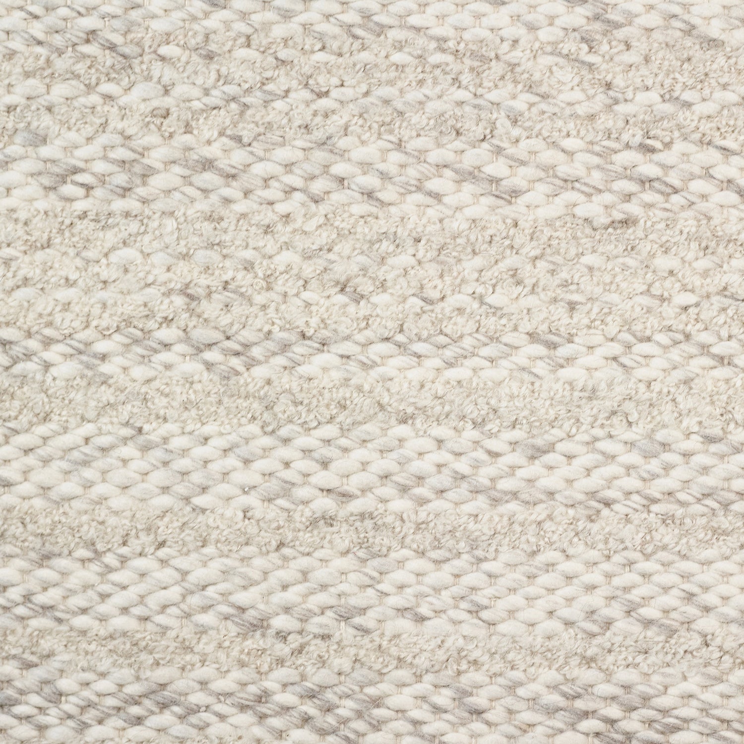 Wool broadloom carpet swatch in a textured stripe weave in cream.