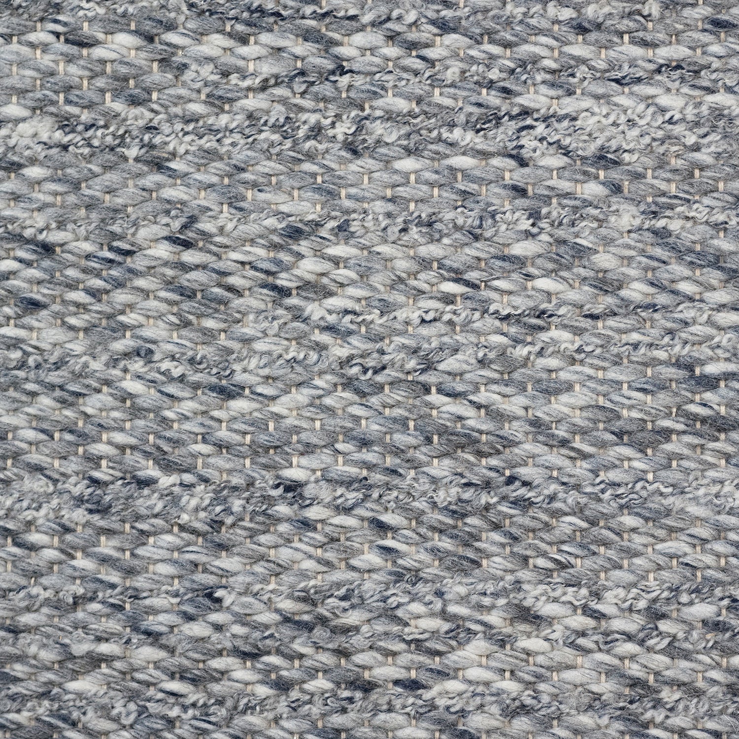 Wool broadloom carpet swatch in a textured stripe weave in mottled blue.