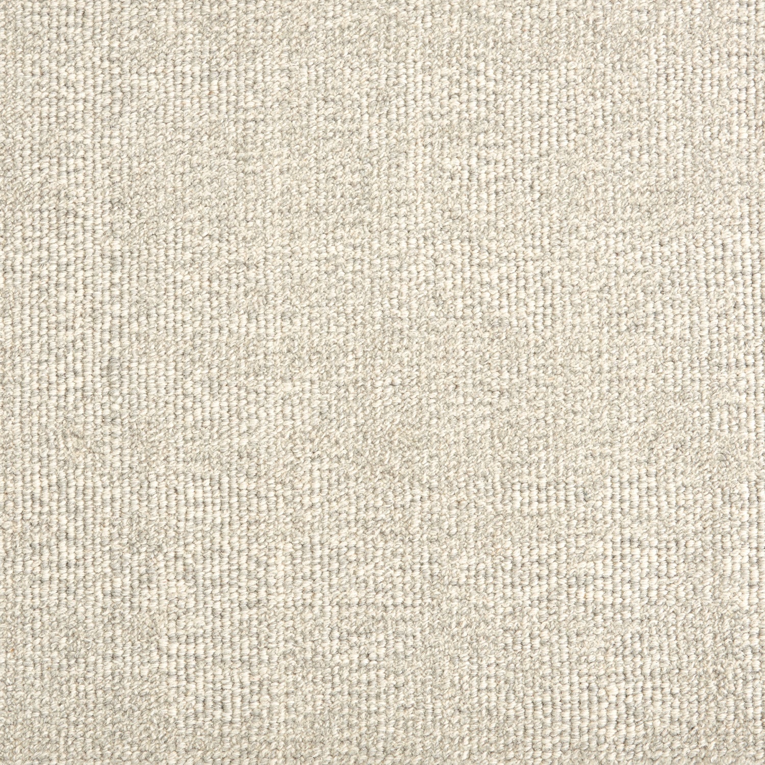 Wool broadloom carpet swatch in a textured weave in mottled cream.