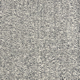 Wool broadloom carpet swatch in a textured weave in mottled white and charcoal.