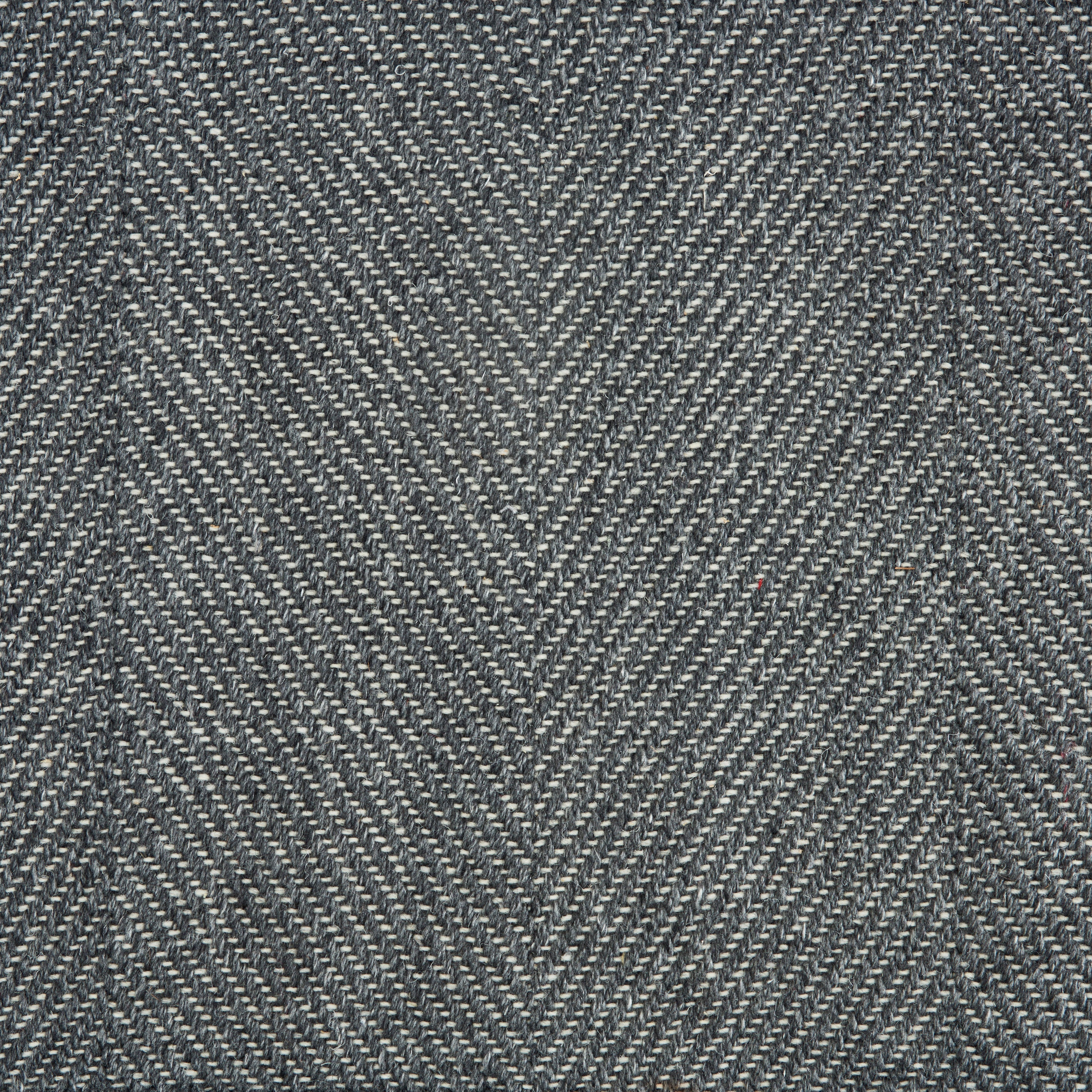 Wool-blend broadloom carpet swatch in a flat herringbone weave in mottled charcoal.