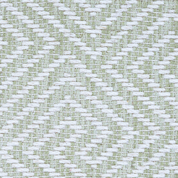 Wool broadloom carpet swatch in a dimensional geometric weave in light green and white.