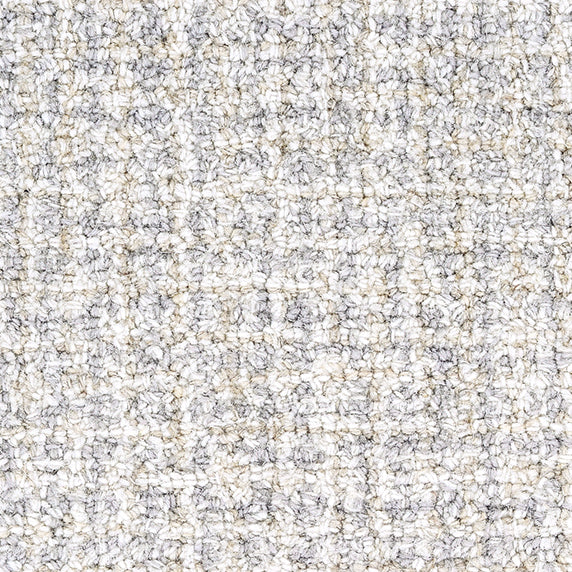 Wool broadloom carpet swatch in a high-pile weave in mottled white, cream and tan.