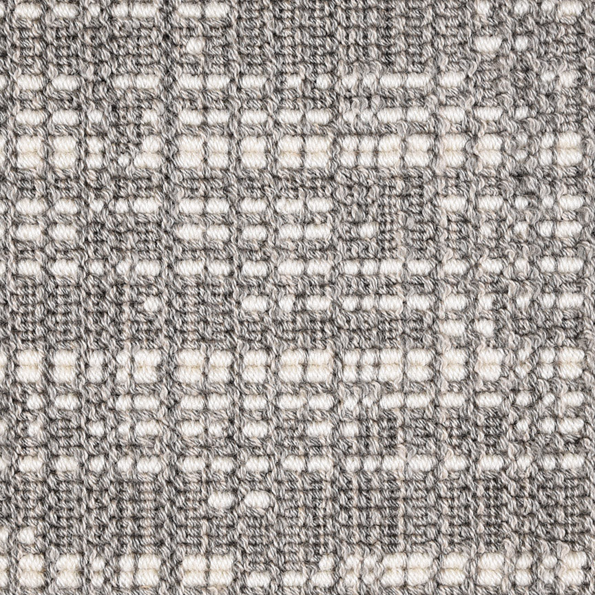 Wool broadloom carpet swatch in an abstract grid print in cream and gray.